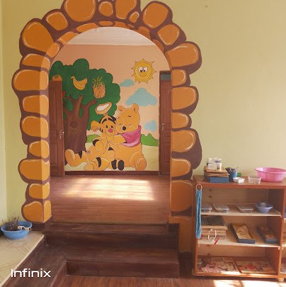 Friendly pencil character saying Hi mural